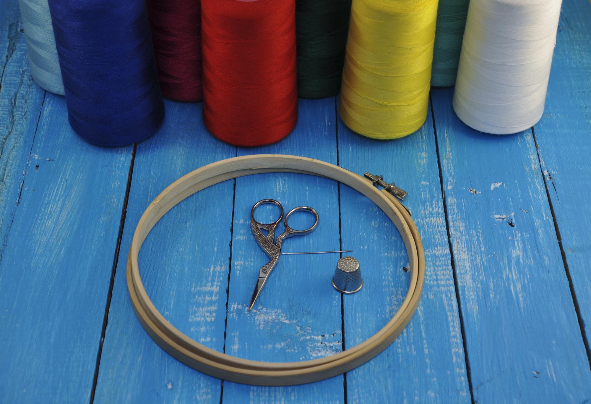 Studio desk with hoop and thread spools